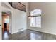 Bright dining area with hardwood floors, a modern chandelier, and a view to the kitchen at 10486 Cheetah Winds, Lone Tree, CO 80124