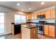 Modern kitchen equipped with stainless steel appliances and a functional center island at 10486 Cheetah Winds, Lone Tree, CO 80124