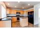 Spacious kitchen offers ample counter space, modern appliances, and a functional center island at 10486 Cheetah Winds, Lone Tree, CO 80124