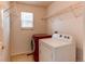 Laundry room features a side-by-side washer and dryer and wire shelving at 10486 Cheetah Winds, Lone Tree, CO 80124
