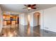 Bright, open living room area showcases access to kitchen and a neutral color palette at 10486 Cheetah Winds, Lone Tree, CO 80124