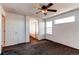 This main bedroom has neutral walls and a ceiling fan, with access to ensuite bathroom and natural light from windows at 10486 Cheetah Winds, Lone Tree, CO 80124