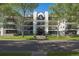 Beautiful apartment building exterior with manicured landscaping, sidewalks, and a decorative entryway at 345 Fillmore # 407, Denver, CO 80206