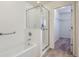 Well-lit bathroom featuring a glass shower enclosure at 15273 E 16Th Dr, Aurora, CO 80011