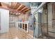 Exposed basement with a utility sink, washer/dryer, and furnace at 8970 Garland Ct, Westminster, CO 80021