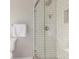 Modern bathroom boasts a tiled shower with a glass door and a shower niche at 8970 Garland Ct, Westminster, CO 80021