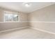 Neutral bedroom features hardwood floors and large window at 8970 Garland Ct, Westminster, CO 80021