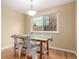 Dining room with hardwood floors and a modern table and chair set at 8970 Garland Ct, Westminster, CO 80021