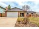 Charming single-story brick home with a two-car garage and well-maintained front yard at 8970 Garland Ct, Westminster, CO 80021