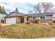 Single Gathering home with a well manicured lawn, brick accents, and two car garage at 8970 Garland Ct, Westminster, CO 80021