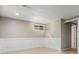 Bright living room with fresh paint, decorative wall trim, and tile flooring at 8970 Garland Ct, Westminster, CO 80021