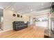 Open-concept living room with hardwood floors, recessed lights, and a view into the kitchen at 8970 Garland Ct, Westminster, CO 80021