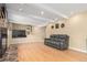 Cozy living room featuring hardwood floors, recessed lighting, and a modern entertainment setup at 8970 Garland Ct, Westminster, CO 80021