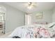 Airy main bedroom with mint walls and light hardwood floors at 8970 Garland Ct, Westminster, CO 80021