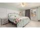 Light and airy main bedroom boasts a ceiling fan and access to the outside at 8970 Garland Ct, Westminster, CO 80021