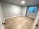 Comfortable bedroom with wood flooring, a window offering plenty of natural light at 6108 S Harvest Ct, Aurora, CO 80016