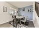 Stylish dining area with a modern table and unique wall decor at 6108 S Harvest Ct, Aurora, CO 80016