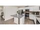 Modern kitchen with granite countertops, stainless steel appliances, and a kitchen island at 6108 S Harvest Ct, Aurora, CO 80016