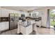 Modern kitchen with granite countertops, stainless steel appliances, and a kitchen island at 6108 S Harvest Ct, Aurora, CO 80016