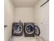 Convenient laundry room features modern appliances and ample space for easy chores at 6108 S Harvest Ct, Aurora, CO 80016