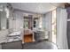 Modern bathroom with double vanities, a view into bedroom, and natural light at 1398 S Fairfax St, Denver, CO 80222