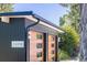 Two-car garage with wood and black accents at 1398 S Fairfax St, Denver, CO 80222