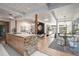 Open concept kitchen with marble island and hardwood floors at 1398 S Fairfax St, Denver, CO 80222