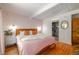 Main bedroom with a plush bed, en-suite bathroom and walk-in closet at 1398 S Fairfax St, Denver, CO 80222