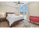 Bright bedroom with large windows, ceiling fan, and ample space at 1401 Jackson St # 204, Golden, CO 80401