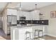 Modern kitchen with stainless steel appliances and island at 1401 Jackson St # 204, Golden, CO 80401