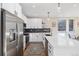 Modern kitchen with stainless steel appliances and island at 1401 Jackson St # 204, Golden, CO 80401