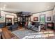 Entertaining space with wet bar, seating area, built-in shelving, and decorative lighting fixtures at 1350 E Greenwood Ln, Greenwood Village, CO 80121