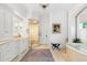 Bright bathroom featuring a modern glass enclosed shower, soaking tub and white vanity at 1350 E Greenwood Ln, Greenwood Village, CO 80121