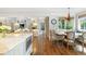 Kitchen with breakfast nook that opens up to a spacious living room with fireplace and built-in shelving at 1350 E Greenwood Ln, Greenwood Village, CO 80121