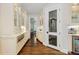 A pantry with hardwood floors, white cabinets, and glass doors displays ample storage and counter space at 1350 E Greenwood Ln, Greenwood Village, CO 80121