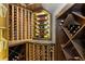 A temperature-controlled wine cellar provides ample storage with wooden shelving and display niches at 1350 E Greenwood Ln, Greenwood Village, CO 80121