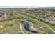 A beautiful aerial view with a pond and walking trail in the neighborhood at 12270 W 57Th Ave, Arvada, CO 80002