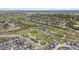 Beautiful aerial view of a neighborhood with a park, pond and new construction homes at 12270 W 57Th Ave, Arvada, CO 80002