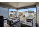 Relaxing covered balcony with seating and neighborhood views; perfect for outdoor enjoyment at 12270 W 57Th Ave, Arvada, CO 80002