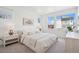 Bright, airy bedroom with large windows, neutral decor, and ample natural light at 12270 W 57Th Ave, Arvada, CO 80002