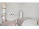 Cozy bedroom featuring a neutral decor, comfortable bed, full length mirror, and closet with sliding door at 12270 W 57Th Ave, Arvada, CO 80002