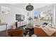 Cozy living room featuring contemporary furnishings, large windows, and stylish decor at 12270 W 57Th Ave, Arvada, CO 80002