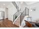 Modern staircase with metal railings, access to multiple floors, and natural light at 12270 W 57Th Ave, Arvada, CO 80002