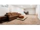 The finished basement provides ample space for recreation, including comfortable seating at 8276 E Easter Pl, Centennial, CO 80112