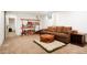 Finished basement area with cozy seating around a bookshelf and comfortable seating at 8276 E Easter Pl, Centennial, CO 80112