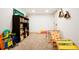 Finished basement with climber and slide, with additional storage and play space at 8276 E Easter Pl, Centennial, CO 80112