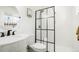 Modern bathroom with a glass-enclosed shower, white subway tile, and sleek fixtures at 8276 E Easter Pl, Centennial, CO 80112