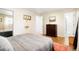 Inviting bedroom with hardwood floors, neutral walls, a full bed, and decor for a cozy retreat at 8276 E Easter Pl, Centennial, CO 80112
