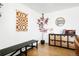 Corner living room with hardwood floors, decor shelving and bench seating at 8276 E Easter Pl, Centennial, CO 80112