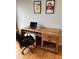 Rustic wooden desk with drawers and metal legs, set up as an inviting home office space at 1555 California St # 610, Denver, CO 80202